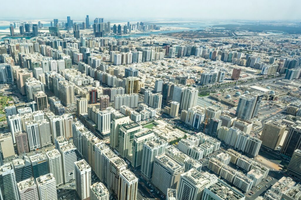 Aerial view of Abu Dhabi's urban environment, representing AI-enabled government and city-scale operating capacity.