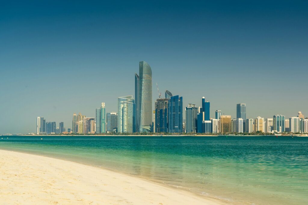 Abu Dhabi skyline across the waterfront, illustrating the emirate's AI and technology economy.